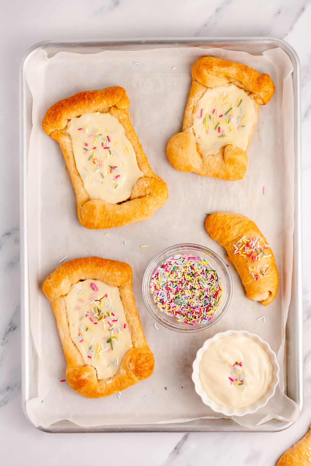 crescent roll cream cheese danishes on a cookie sheet