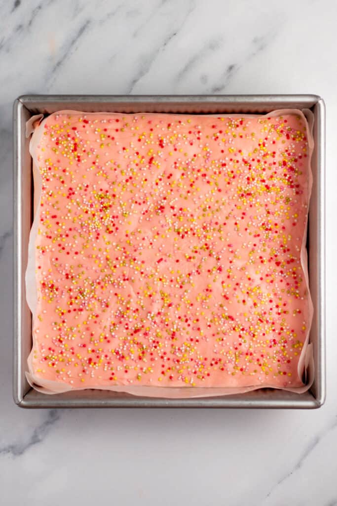pink fudge in a baking pan