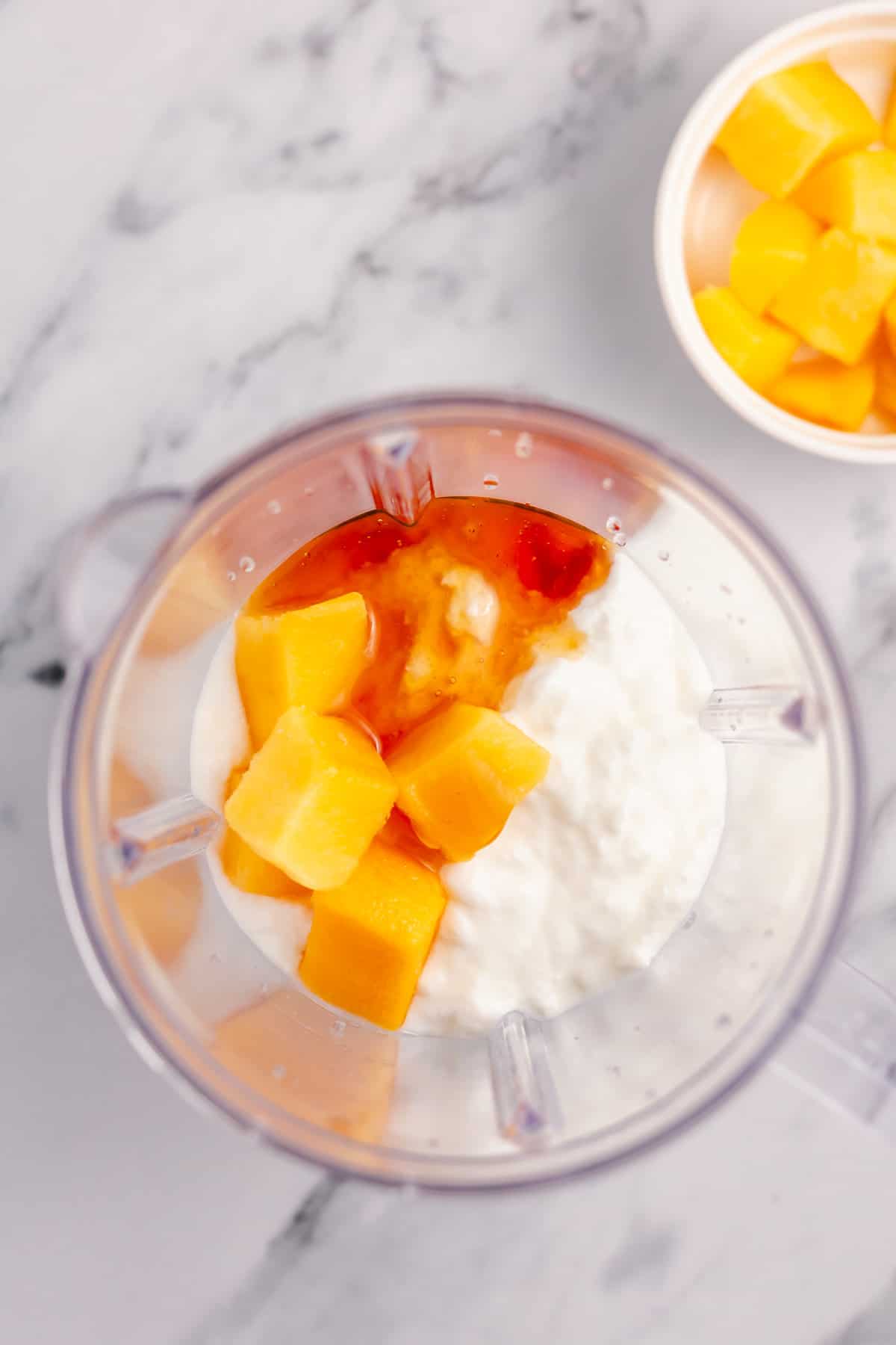 mango, yogurt and honey in a blender