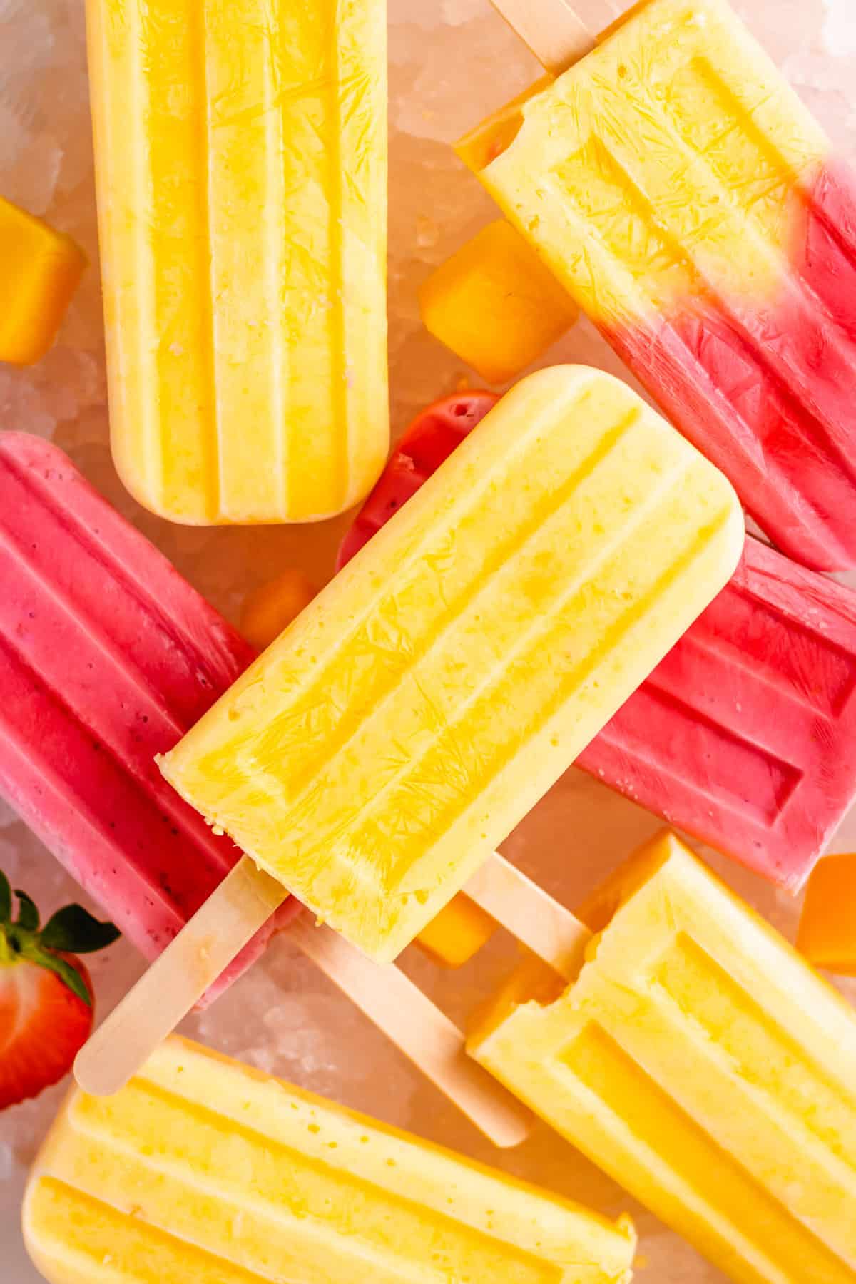 mango and strawberry popsicles close up