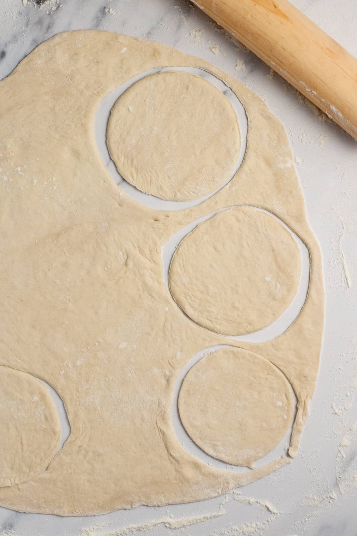 pizza dough cut into circles