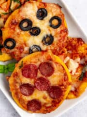 mini pizzas on a white plate