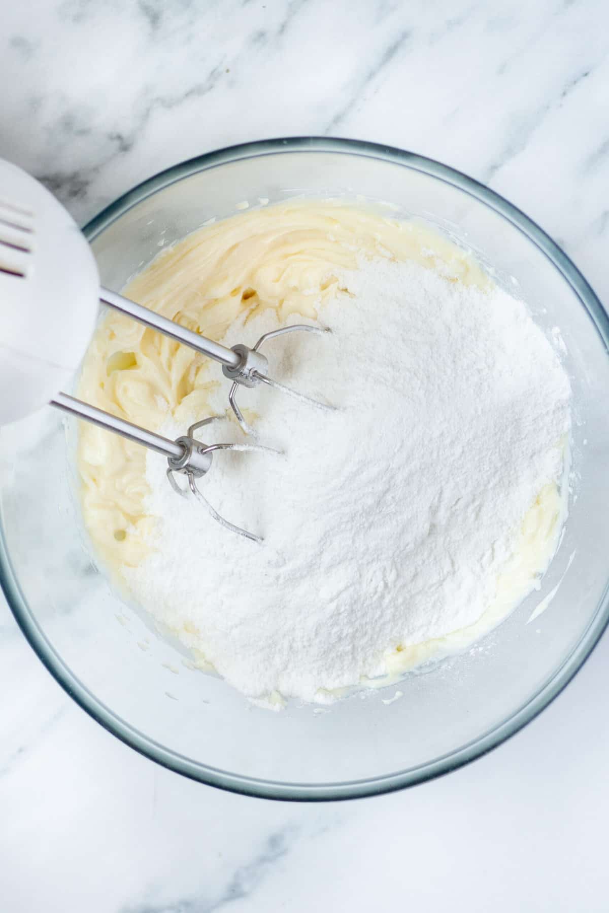 powdered sugar added to a cream cheese mixture