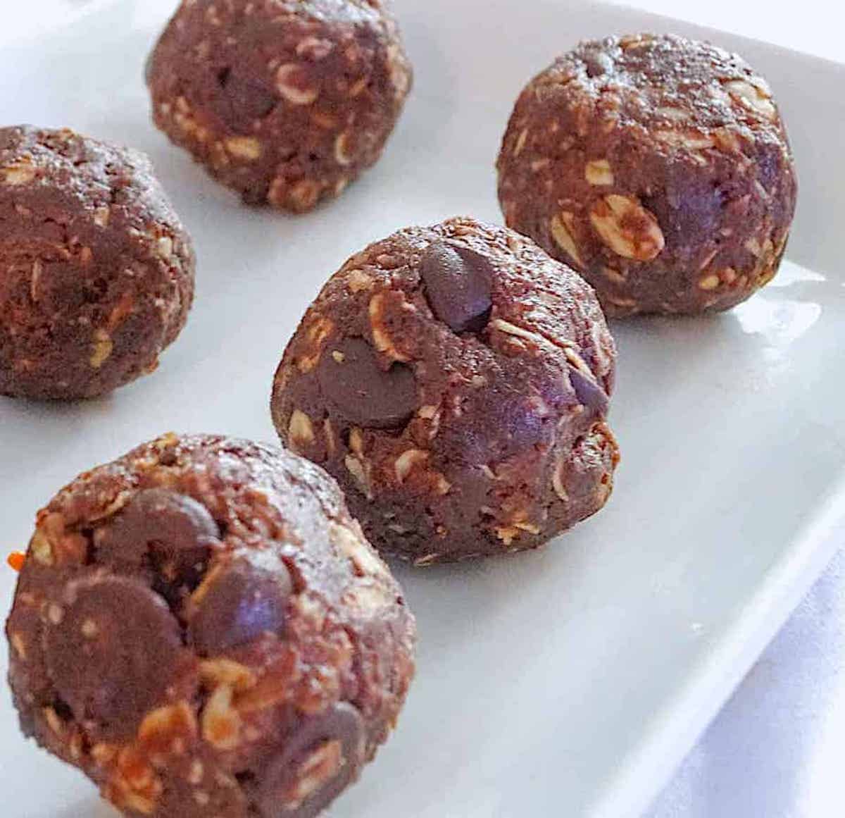 chocolate energy balls on a white plate