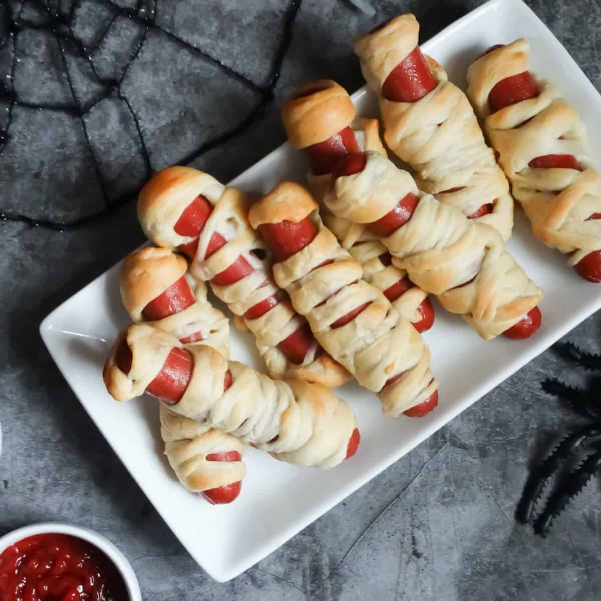 mummy hot dogs on a plate