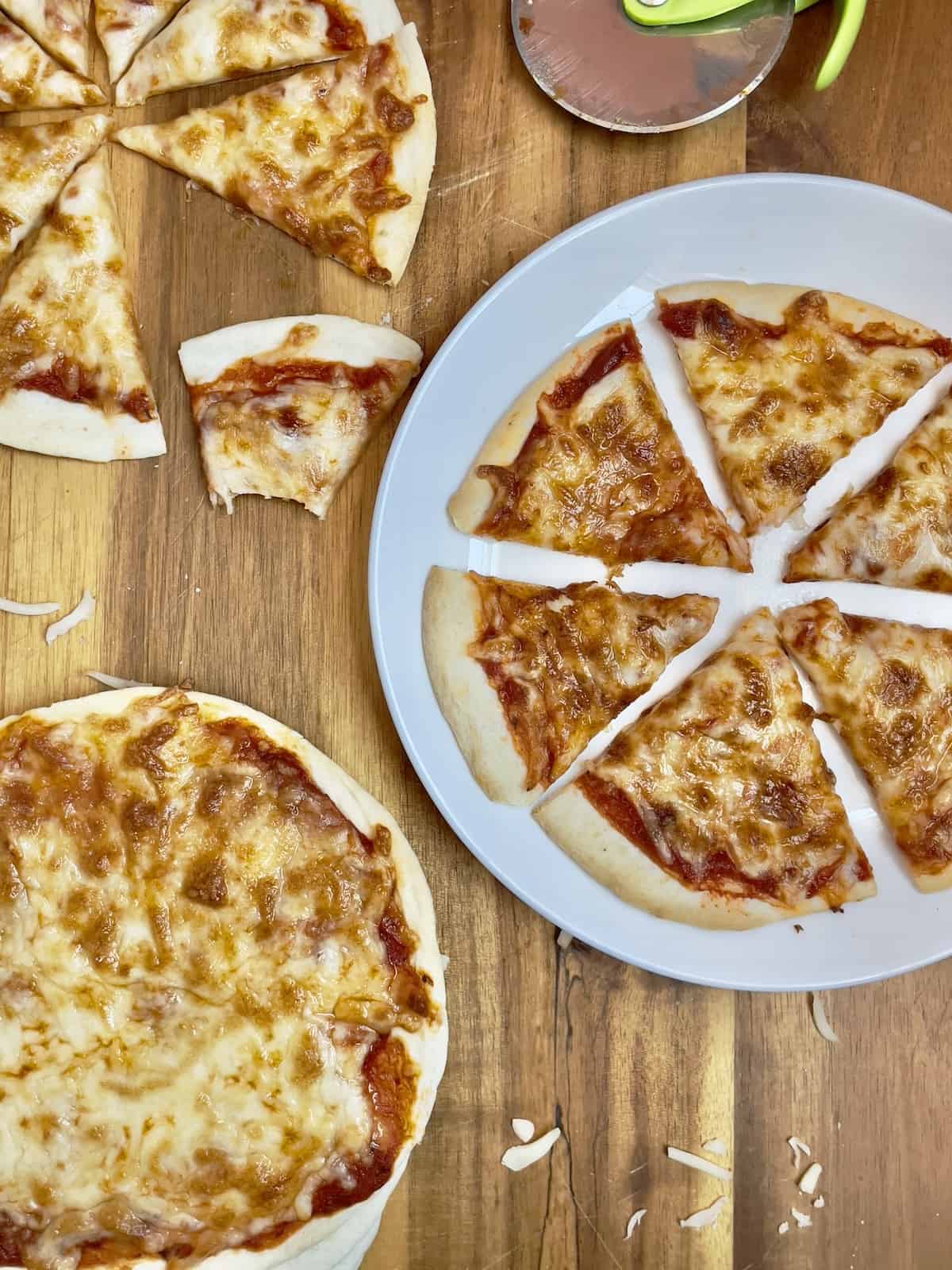 delicious plain cheese tortilla pizza on a cutting board