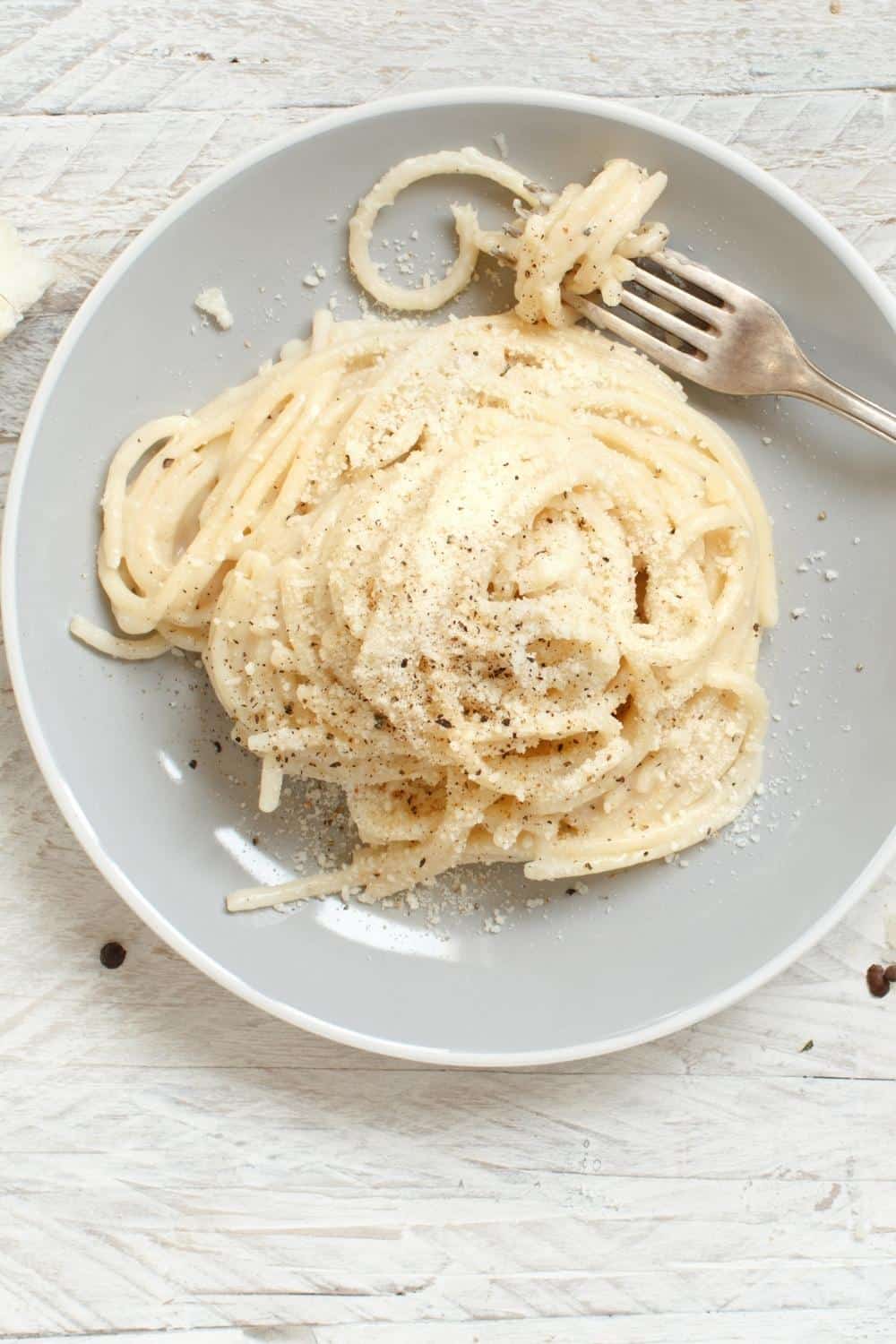 butter spaghetti noodles on a gray plate