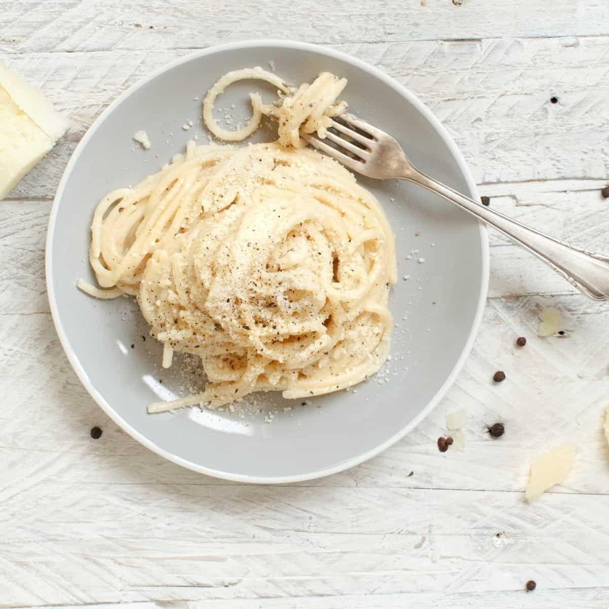 butter spaghetti noodles on a gray plate