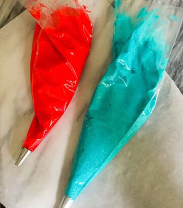 red and blue frosting in a piping bag