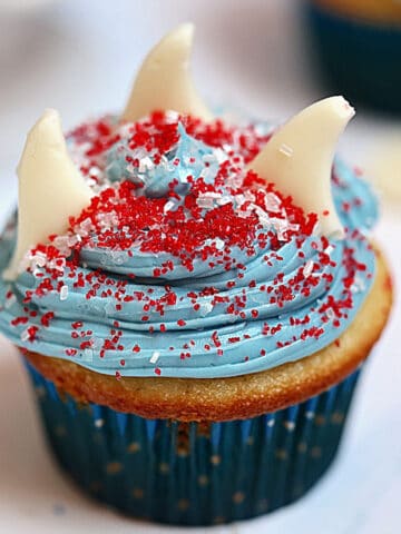 shark cupcake with three fins and sprinkles