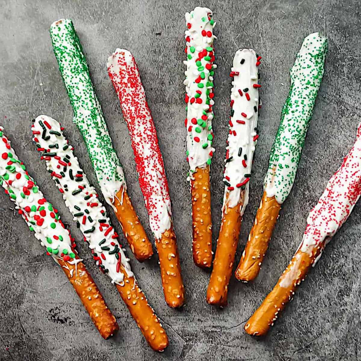 christmas chocolate covered pretzels on a gray background