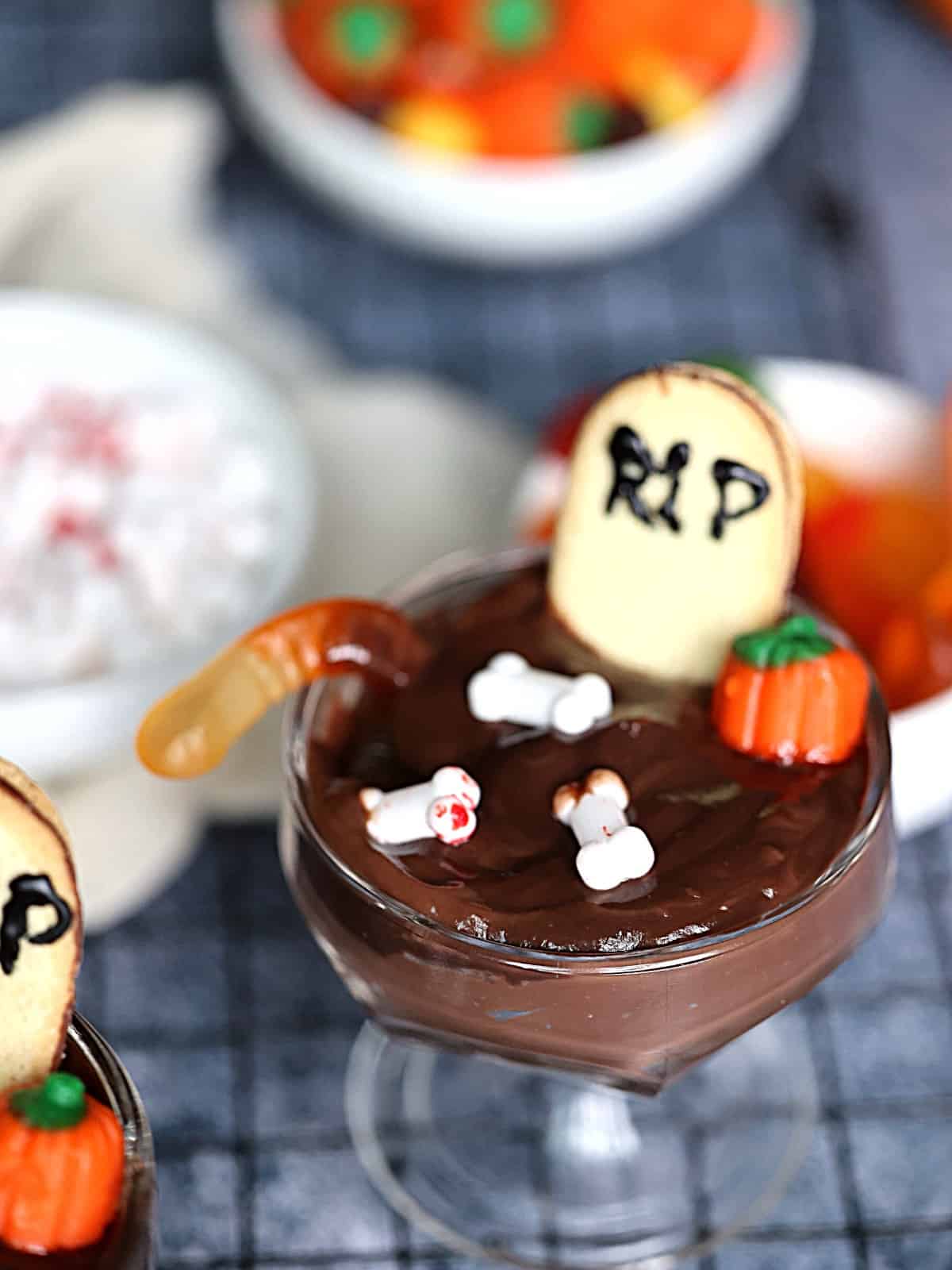 halloween graveyard pudding cups on a gray background