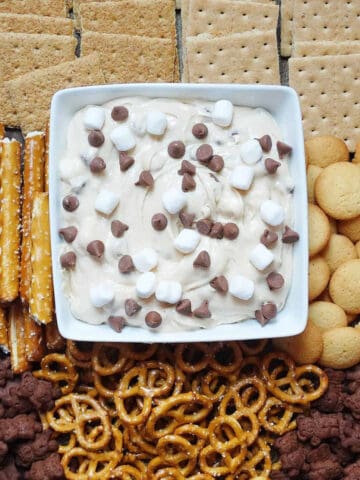 smores board with pretzels and other dippers and cookie dough dip