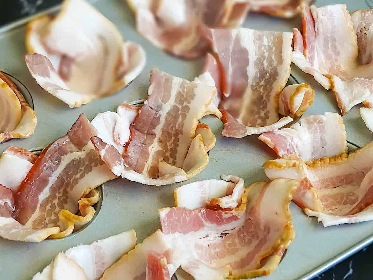 cut bacon slices in mini muffin tins