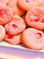pink sugar cookies in a white plate