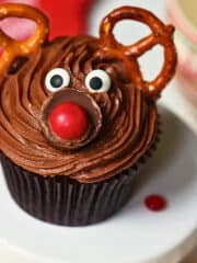 chocolate reindeer cupcake with candy eyes and pretzel antleers