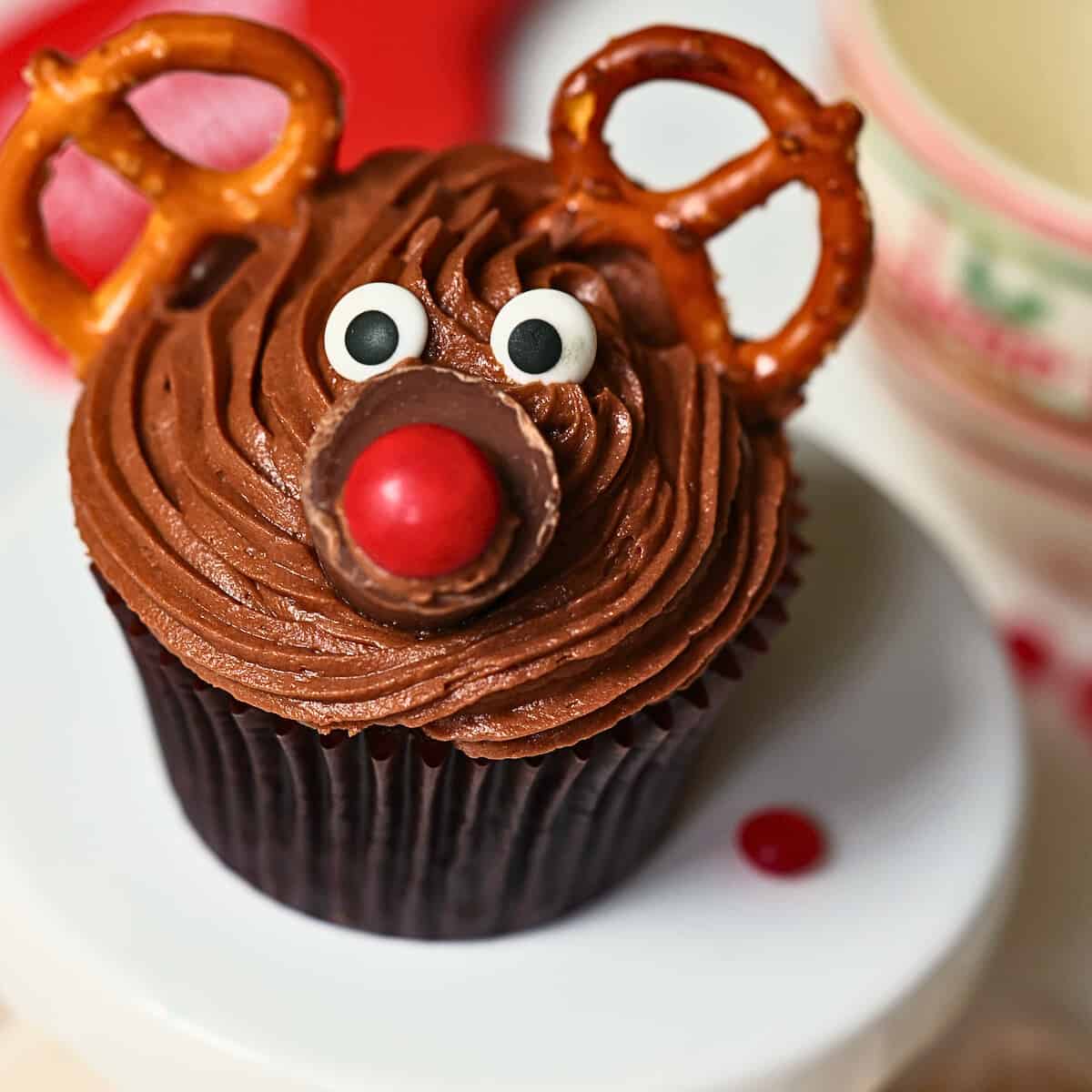 chocolate reindeer cupcake with candy eyes and pretzel antleers