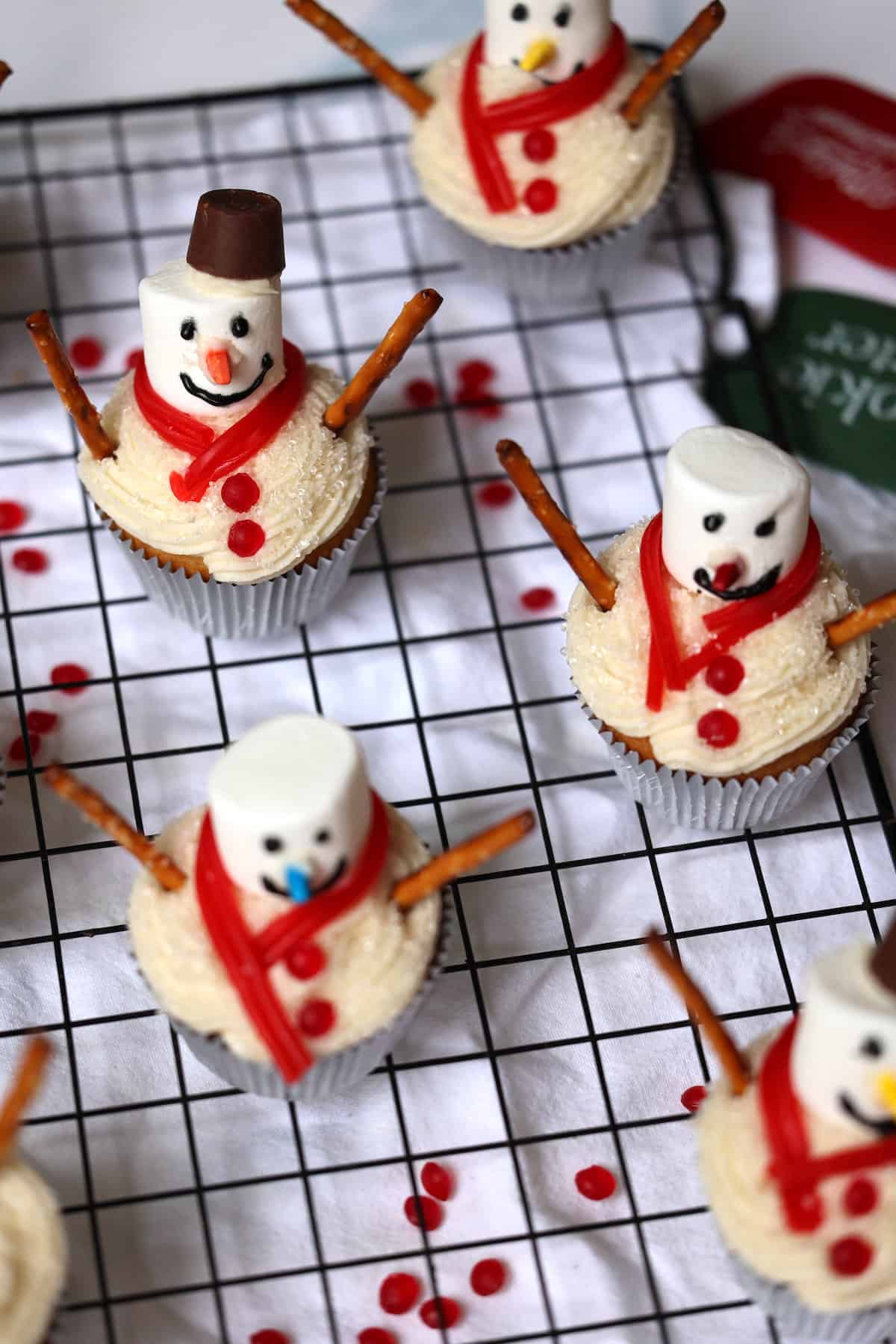 vanilla snowman cupcake topped with a marshmallow snowman