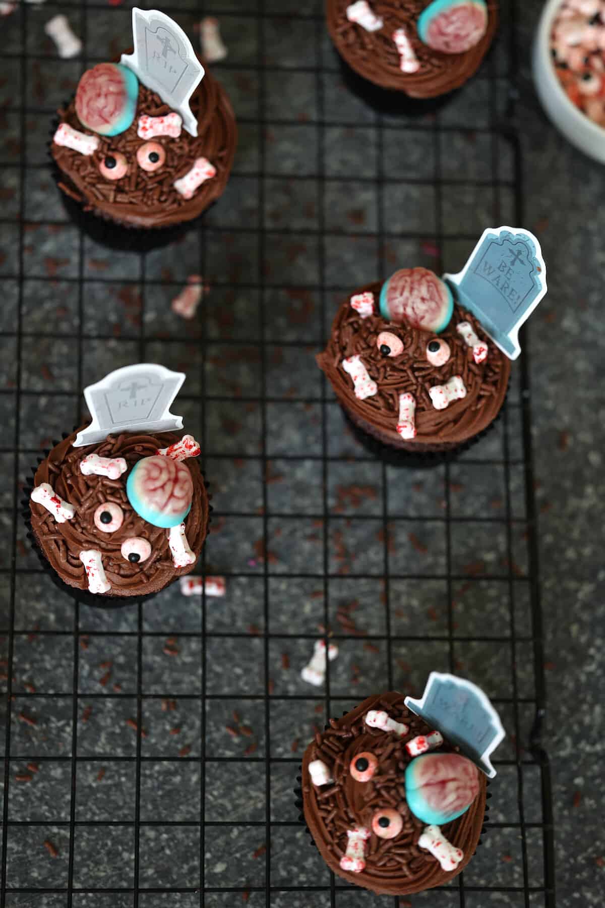 zombie cupcakes on a cooling rack