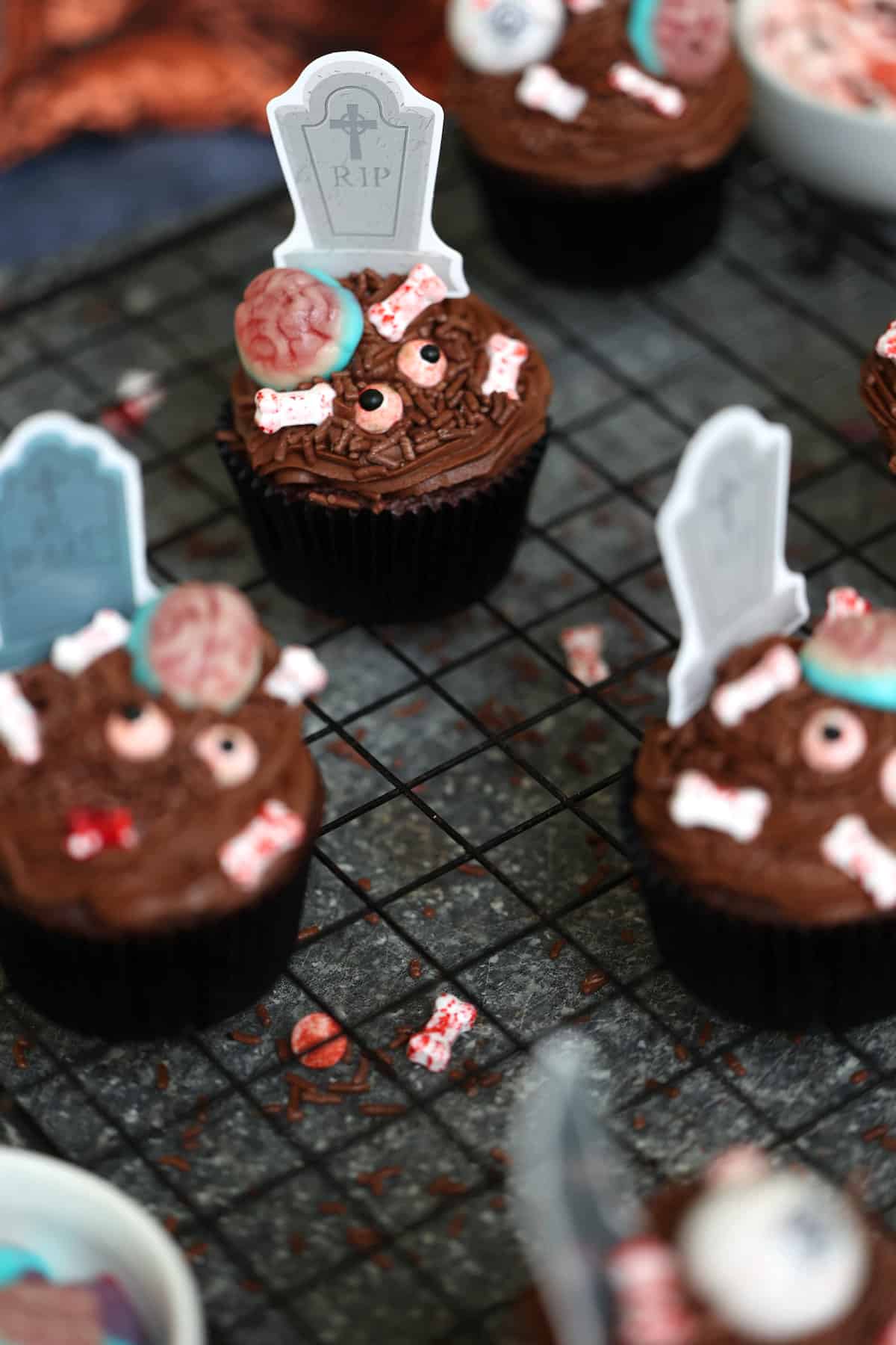 zombie cupcakes on a cooling rack 
