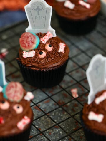 zombie cupcakes on a cooling rack