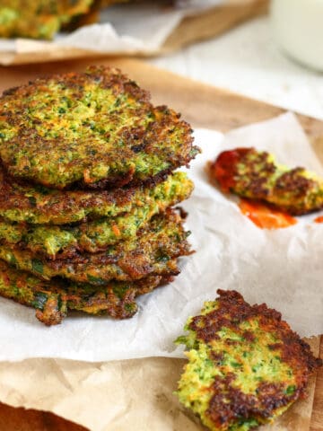broccoli fritters in a stack on paper towels