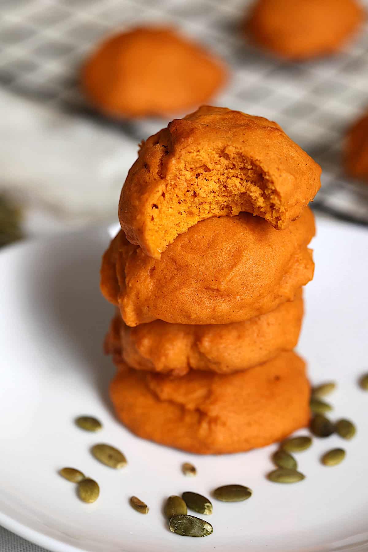 chewy pumpkin cookies in a stack on a plate