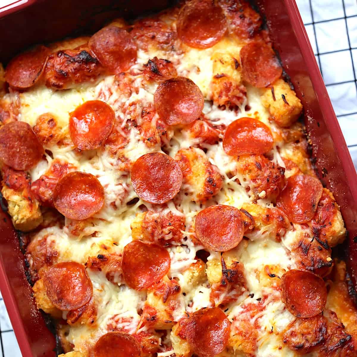 tater tot pizza casserole in a baking dish