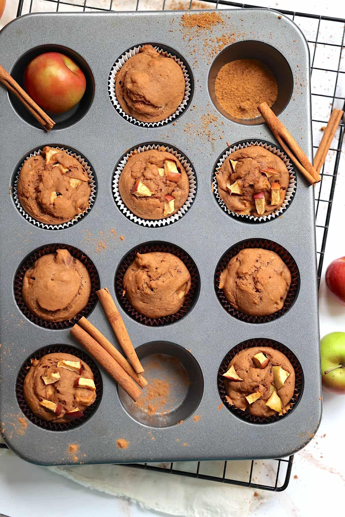 vegan apple muffins in a muffin tin