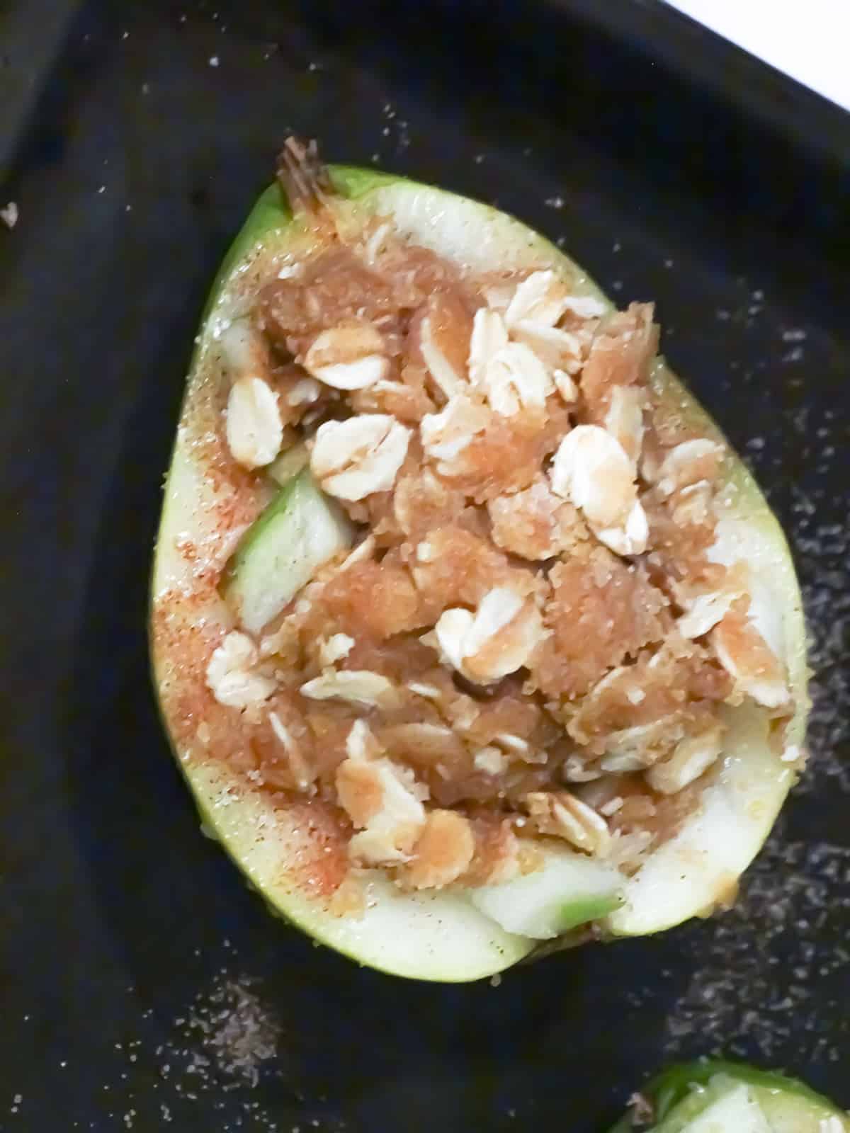 a pear full of apples, oatmeal and sugar filling