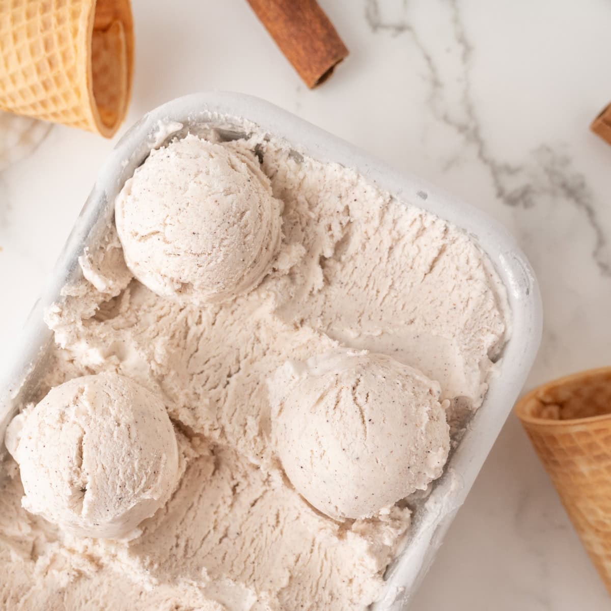 cinnamon ice cream in an ice cream tub
