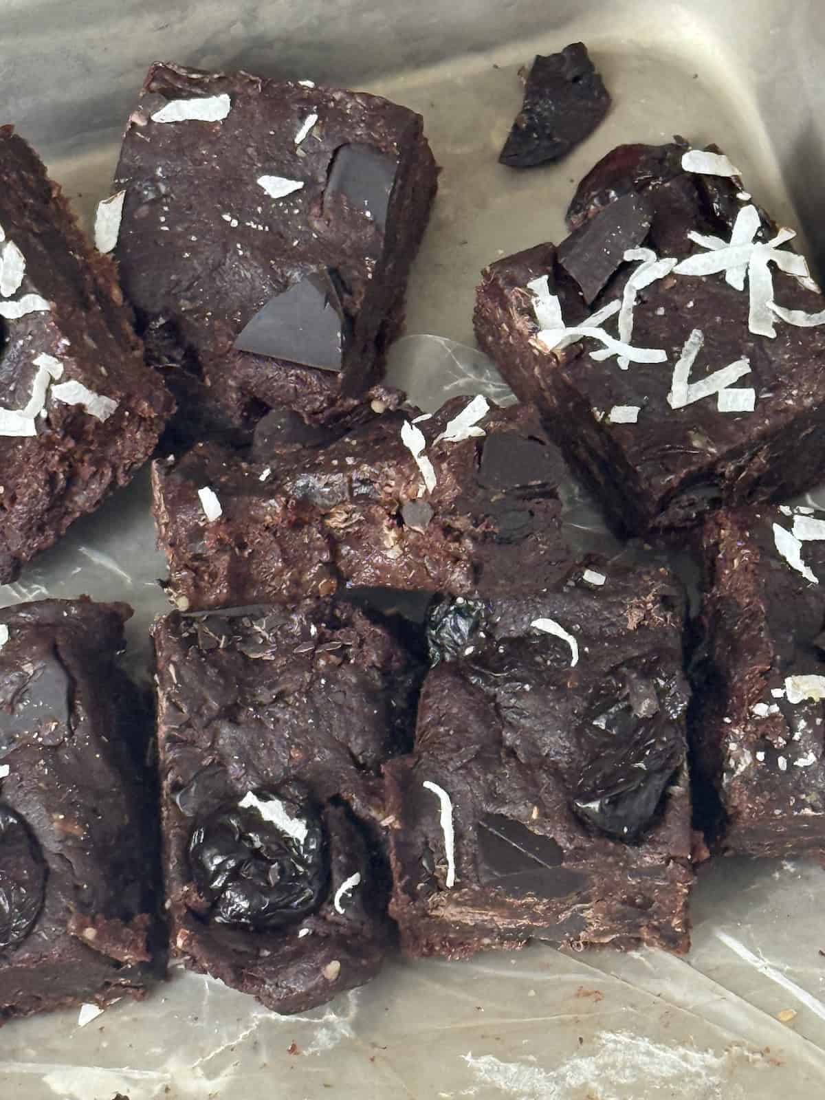 bitten chocolate cherry date brownies on a pan