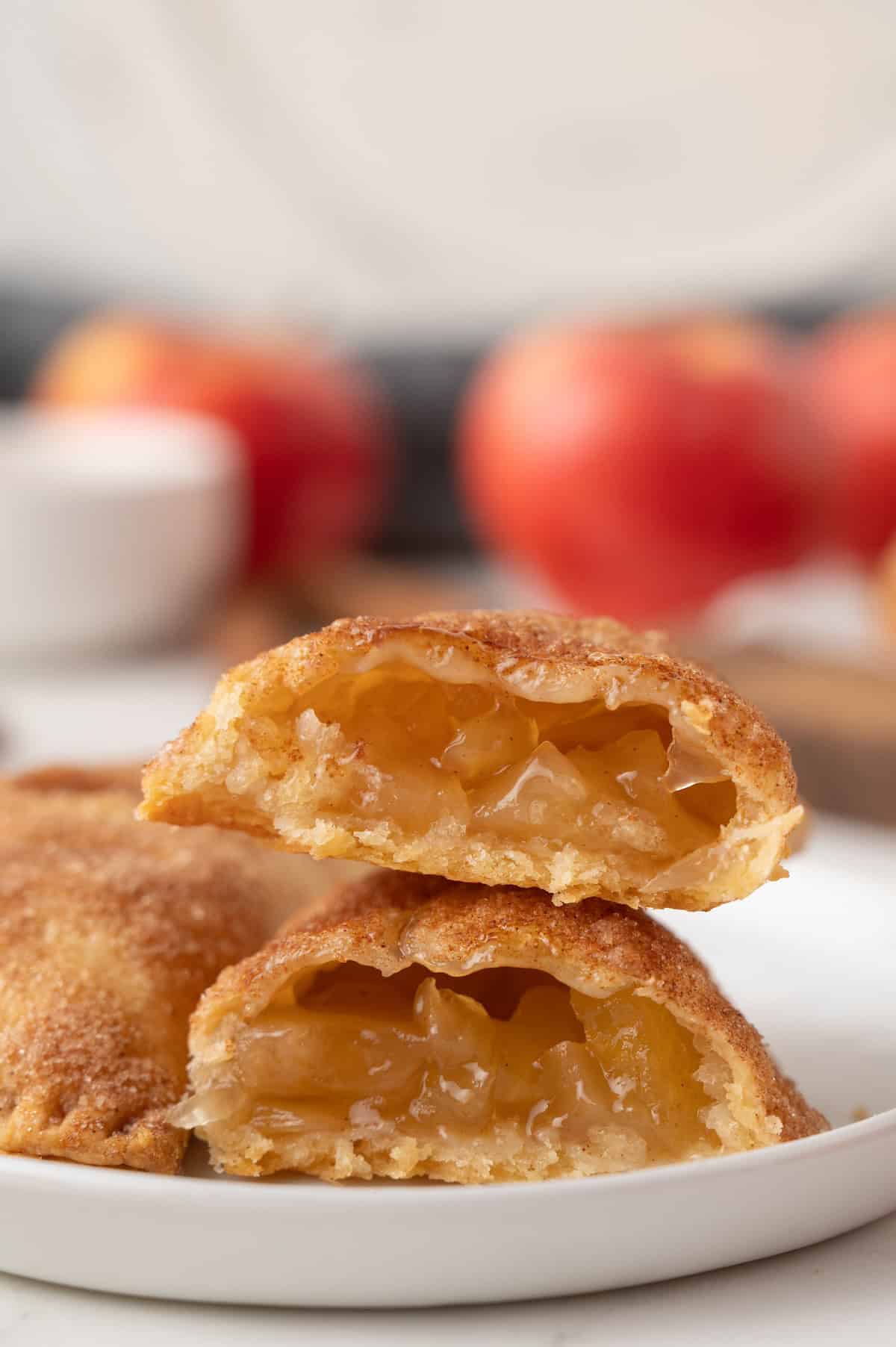 sliced apple hand pies on a plate