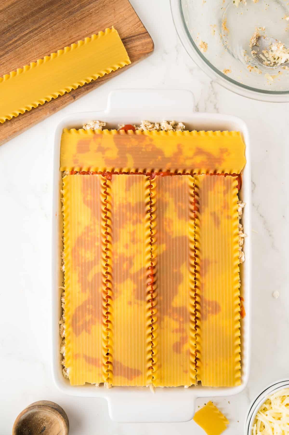 lasagna noodles layered in a baking dish