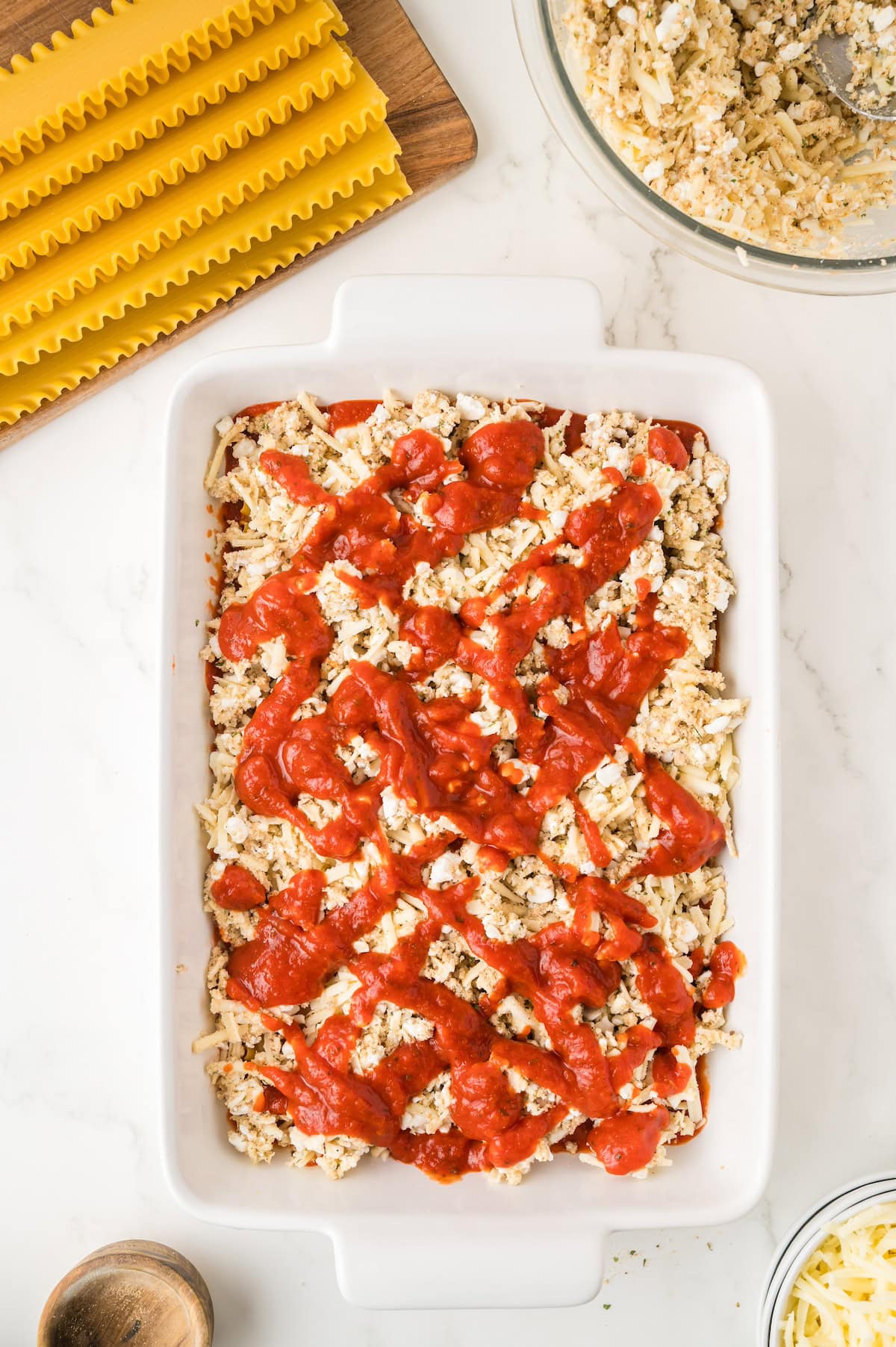unbaked lasagna in a baking dish