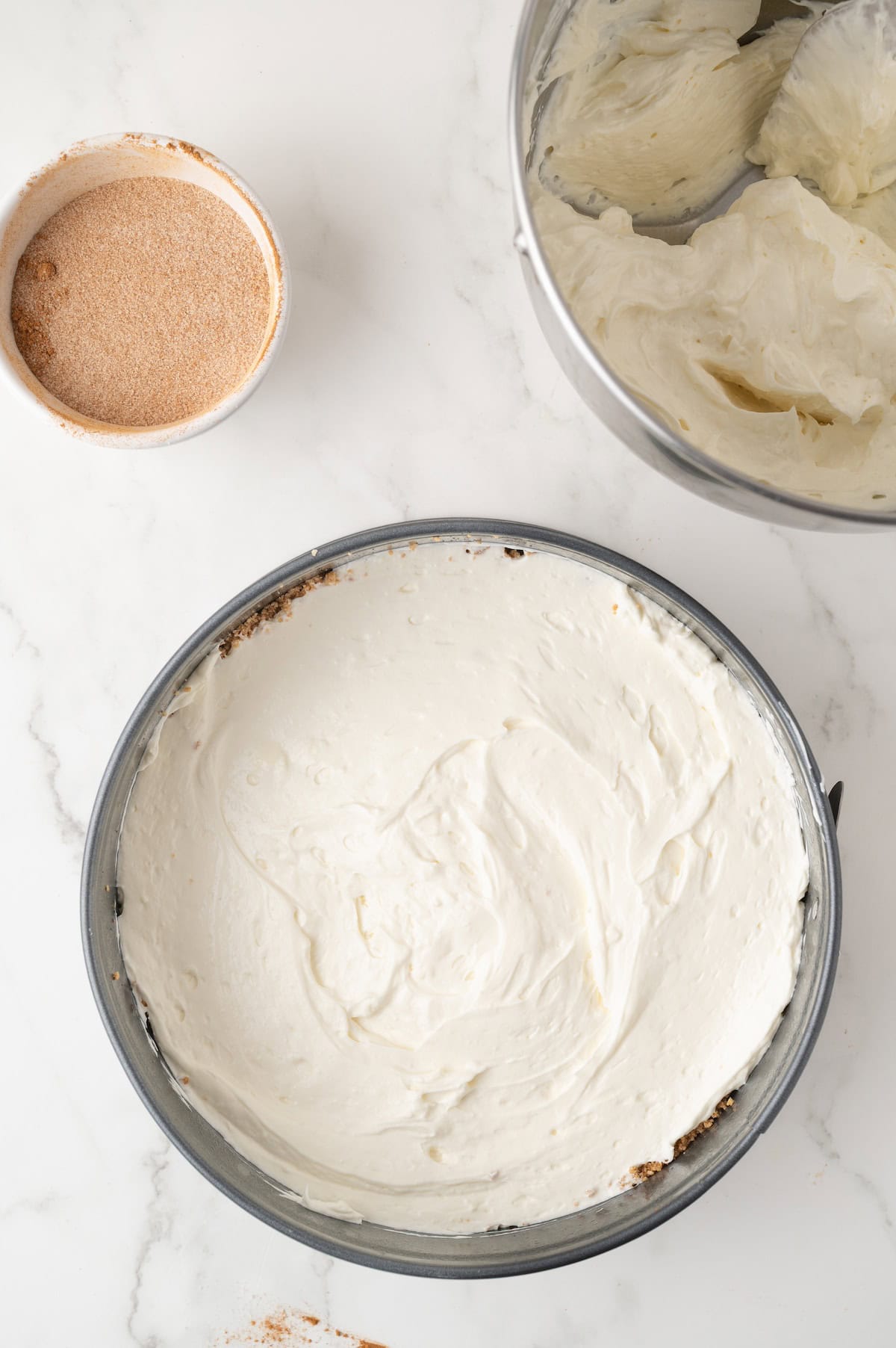 cheesecake filling on crust in a springform pan