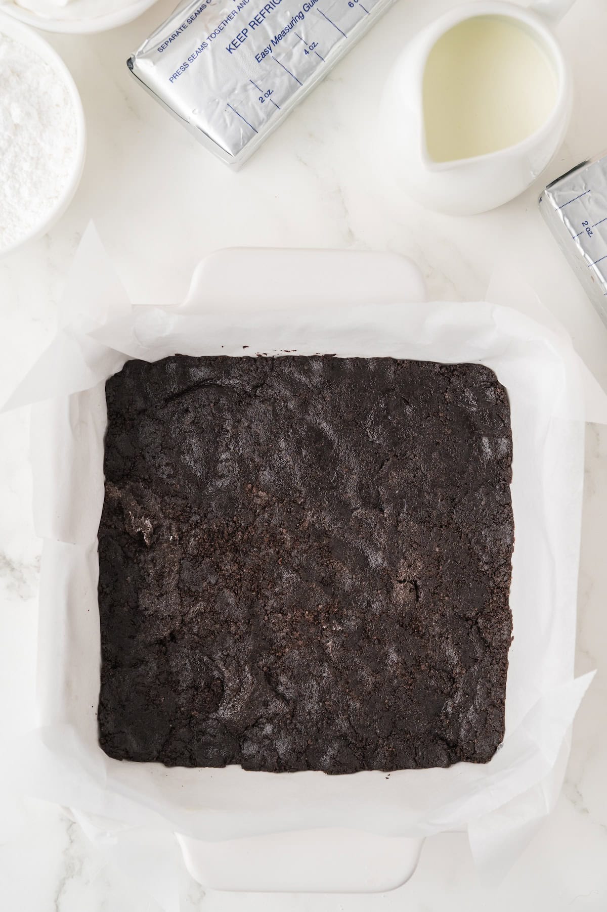 frozen Oreo crust in a baking sheet