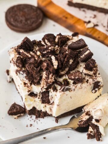 Oreo cheesecake bar on a white plate