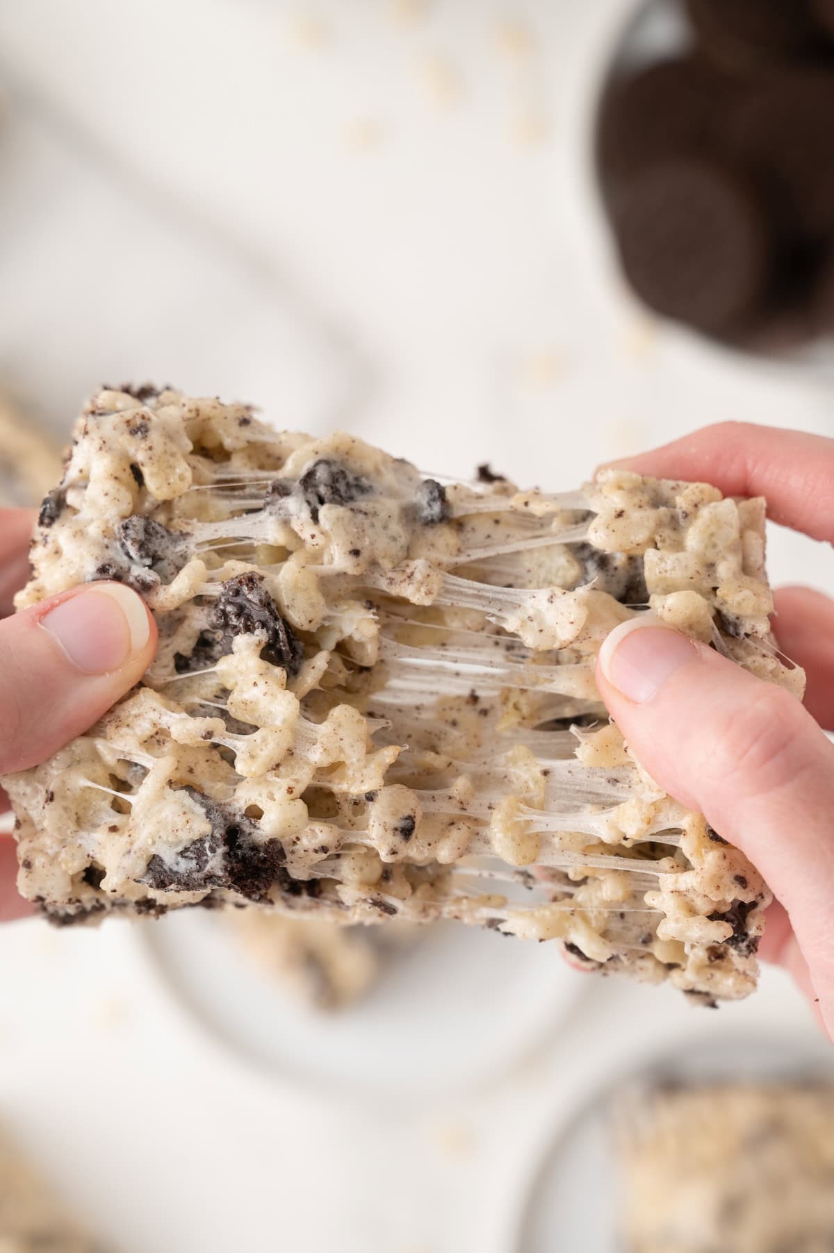 Oreo Rice Krispie being pulled apart