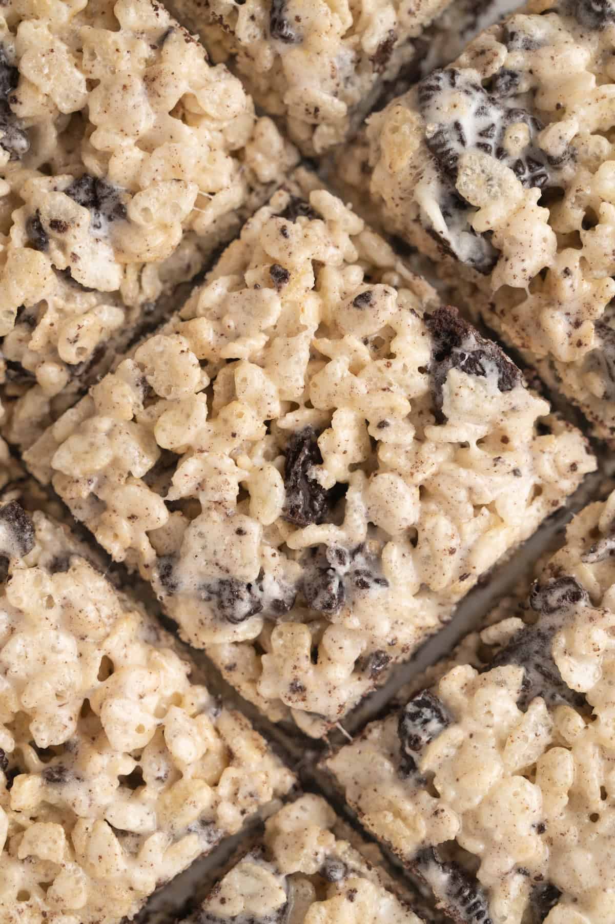 close up shot of sliced Rice Krispie treats on a cutting board