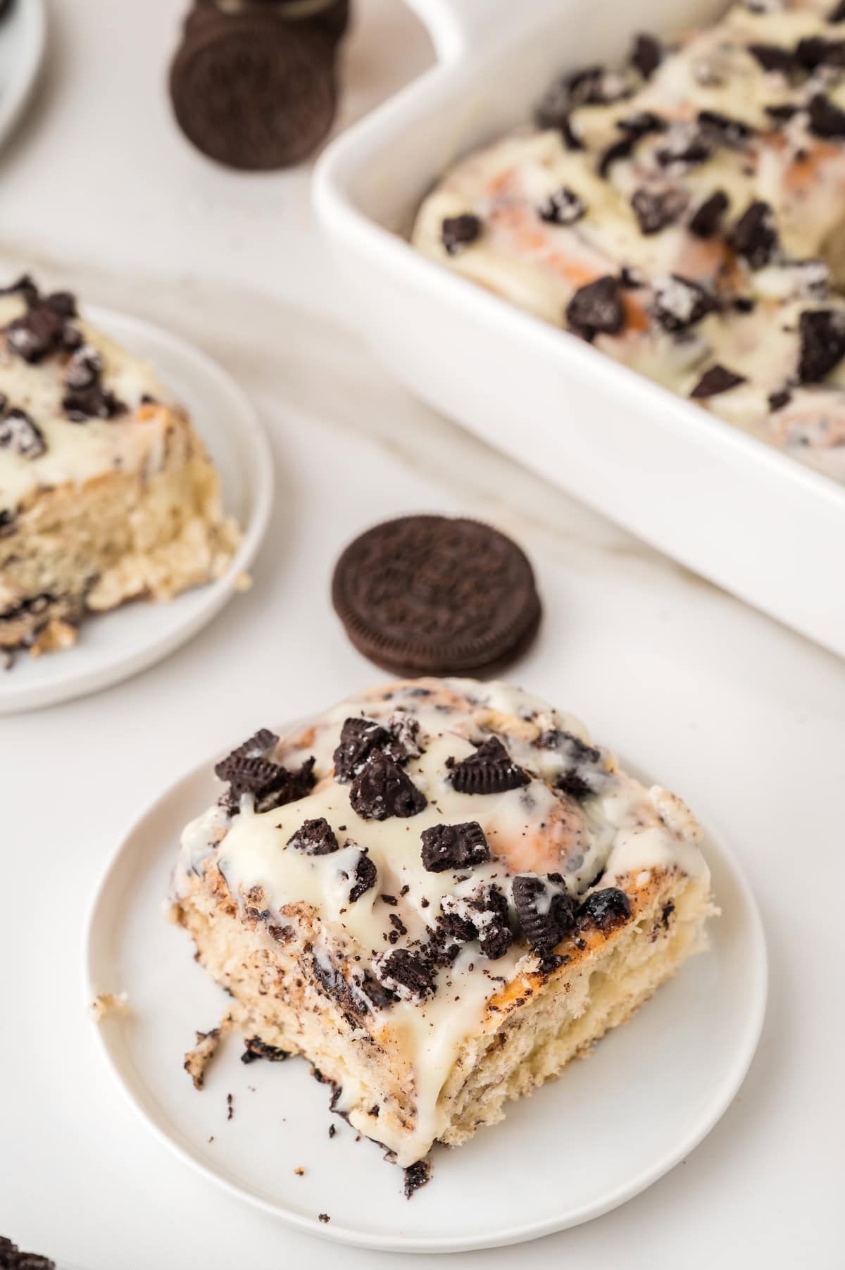one Oreo cinnamon roll on a white plate
