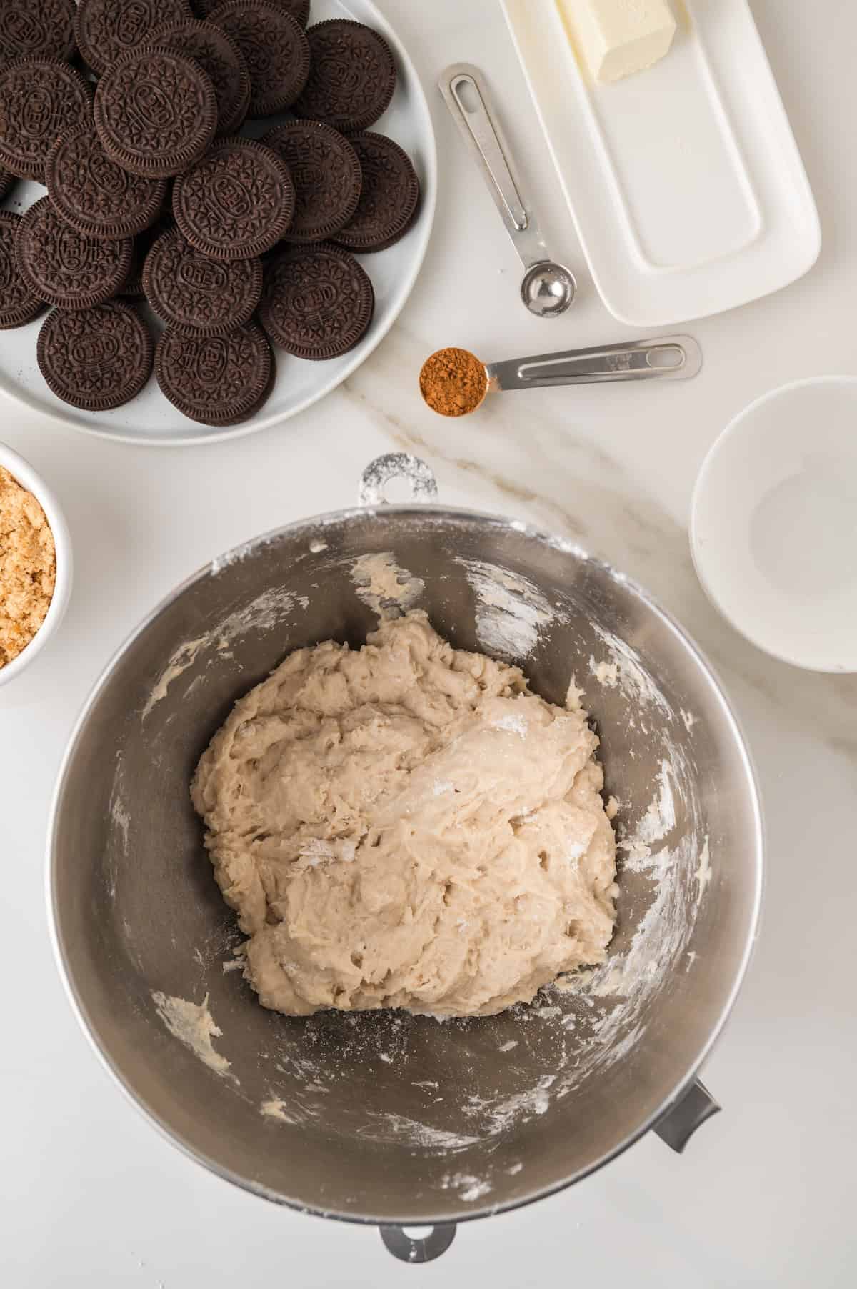cinnamon roll dough in a mixing bowl