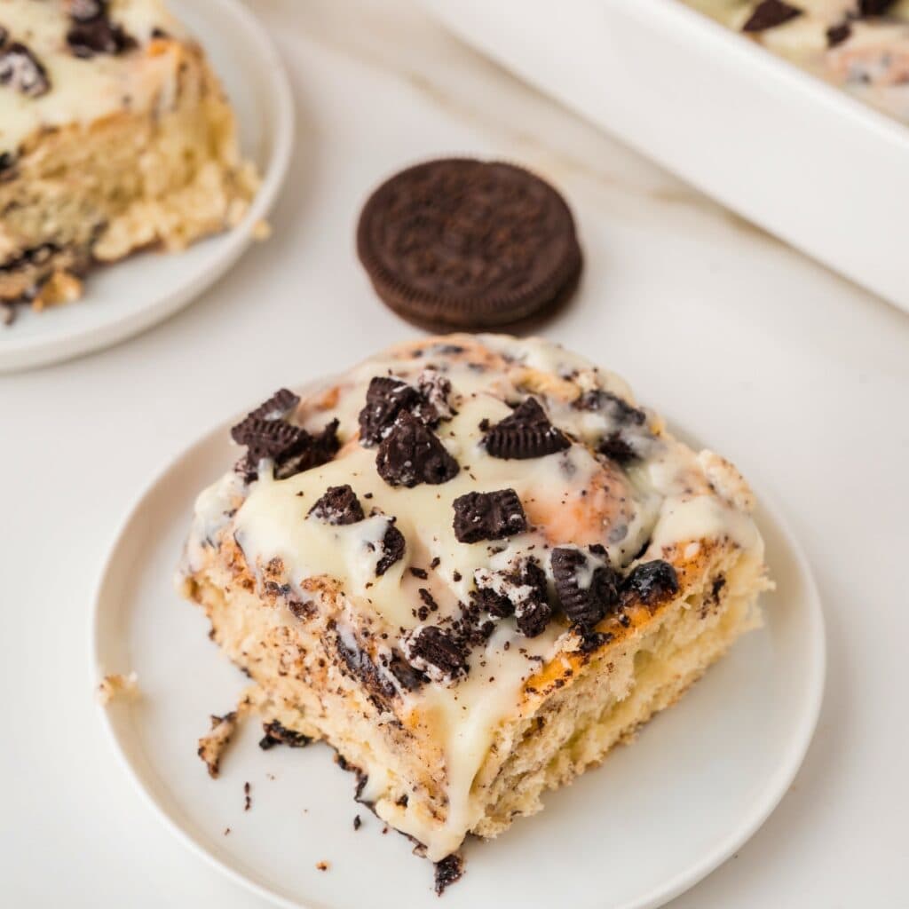 an Oreo cinnamon roll on a white plate
