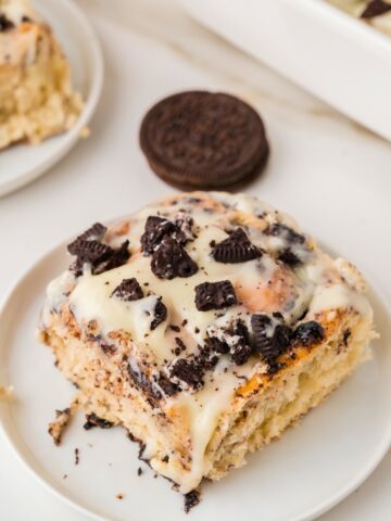 an Oreo cinnamon roll on a white plate