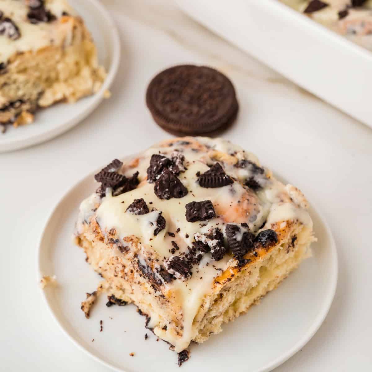 an Oreo cinnamon roll on a white plate