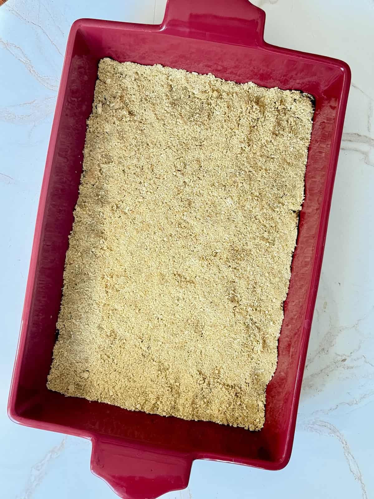 graham cracker crust in a baking dish