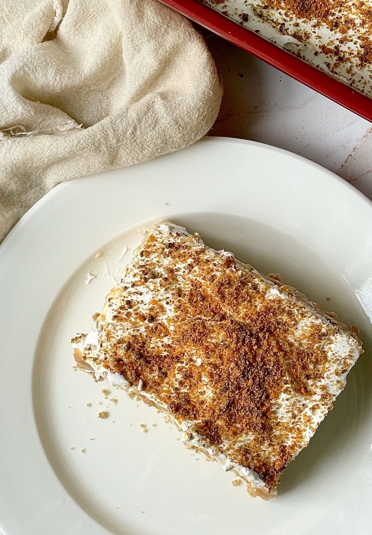 overhead shot of butterscotch layered dessert on a plate