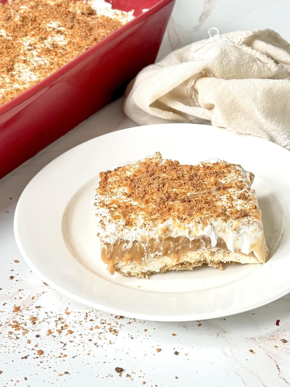 butterscotch pudding dessert slice on a white plate