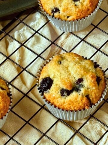 blueberry muffins on a cooling rack