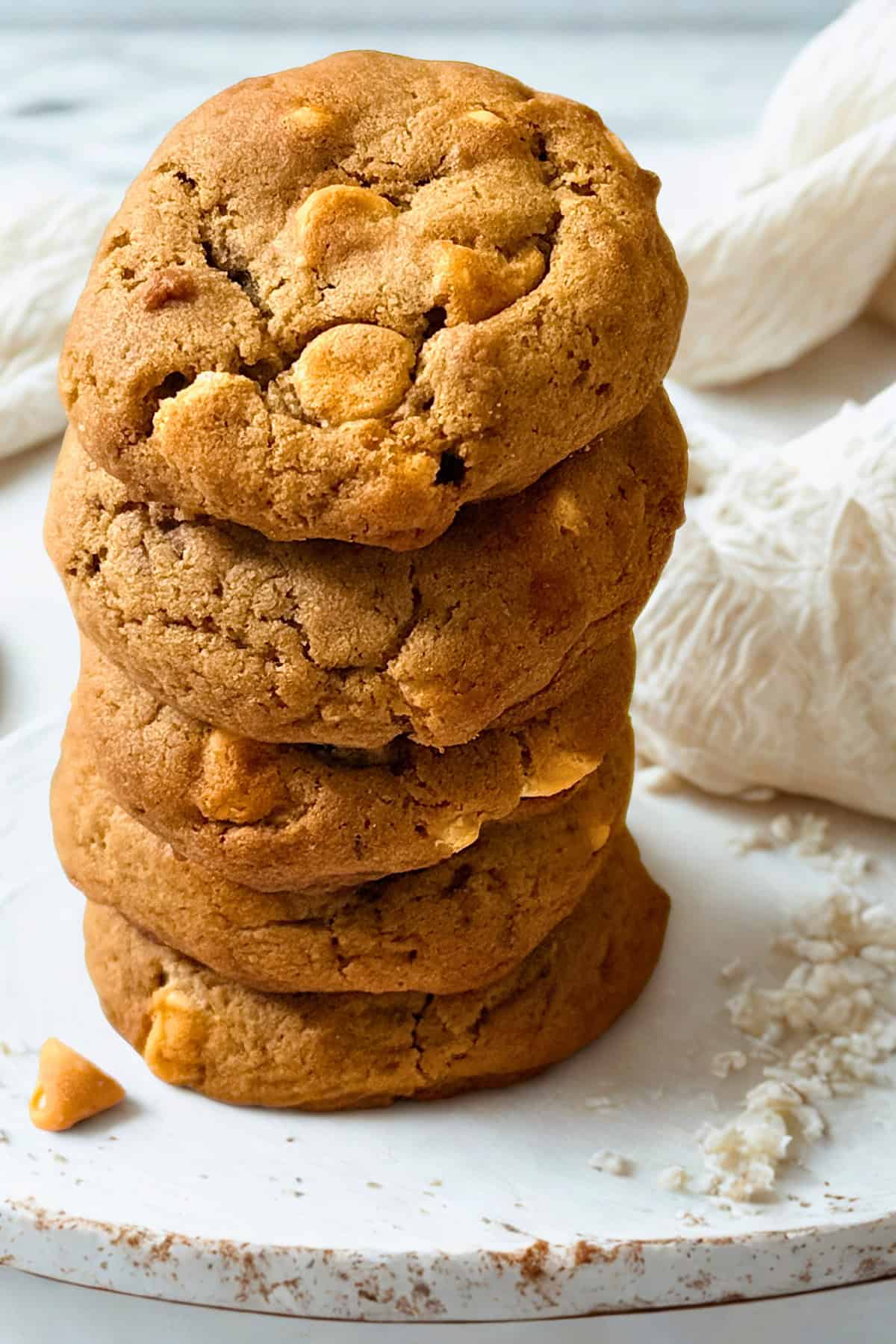 butterscotch cookies in a stack on a white plate